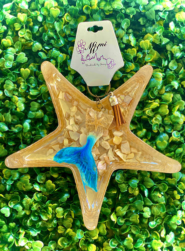 Be Oceanic mermaid tale keychain. Puertorrican sand with sea star and wave color.